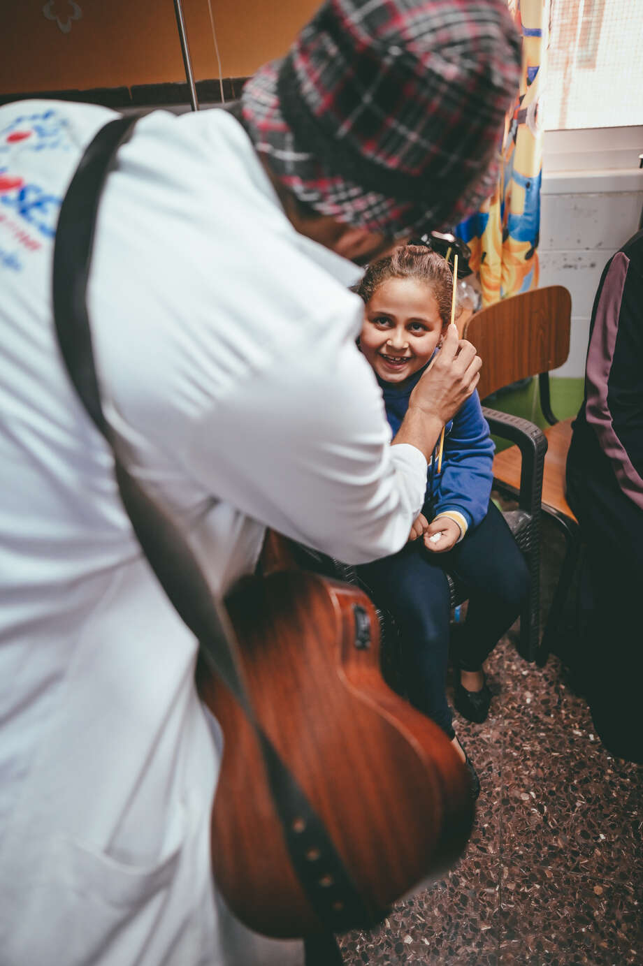 A healthcare clown spreading joy among a hospitalised child